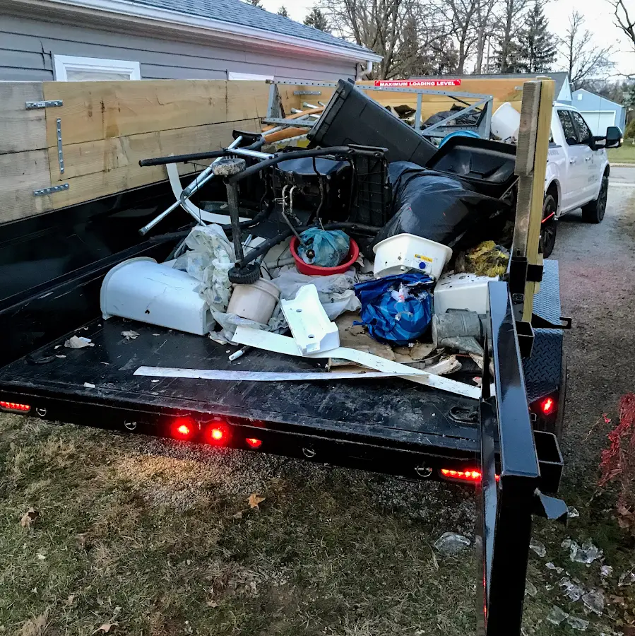 Roll-off dumpster delivered to a residential driveway in Dover